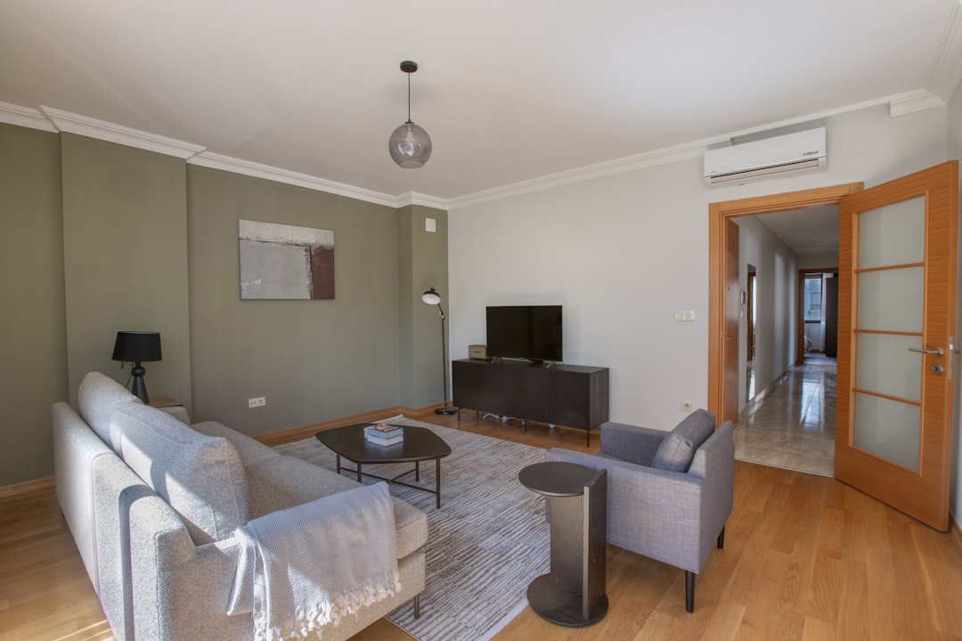a living room filled with furniture and a flat screen tv